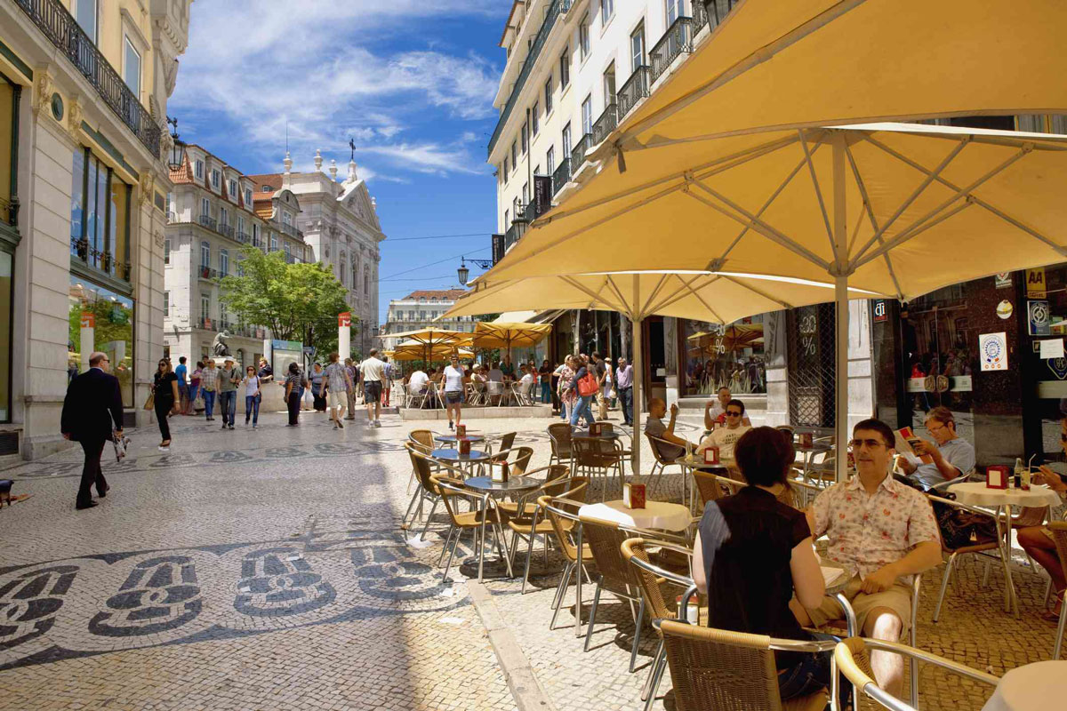 Moving to Portugal from France cafe in Lisbon calcada stone pavement