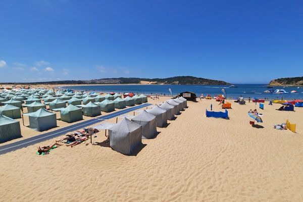 Traditional cloth beach tents on the sand of Sao Martinho do Porto