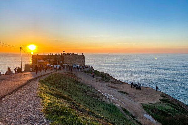 Sunset over Fort Sao Miguel in Nazare Portugal